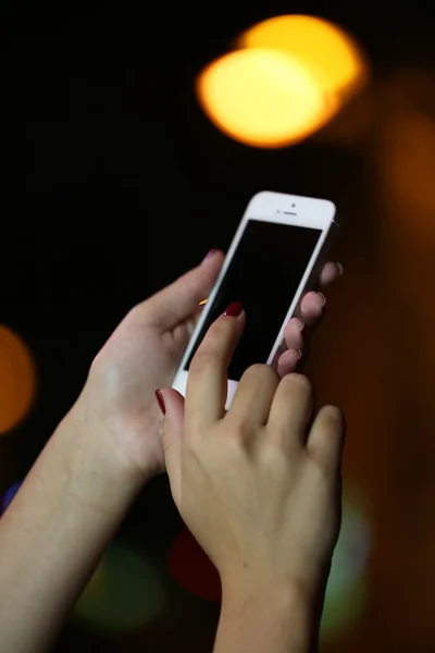 Female hands with mobile phone — Stock Photo, Image