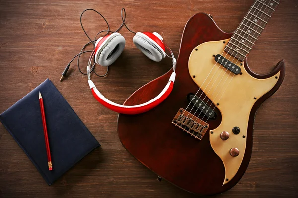 Electric guitar with headphones — Stock Photo, Image