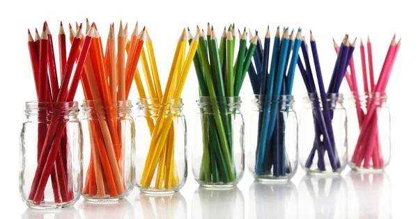 Bright pencils in glass jars, isolated on white — Stock Photo, Image