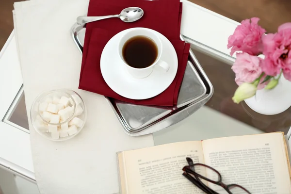 Cup of tea with book on table close up — Stock Photo, Image