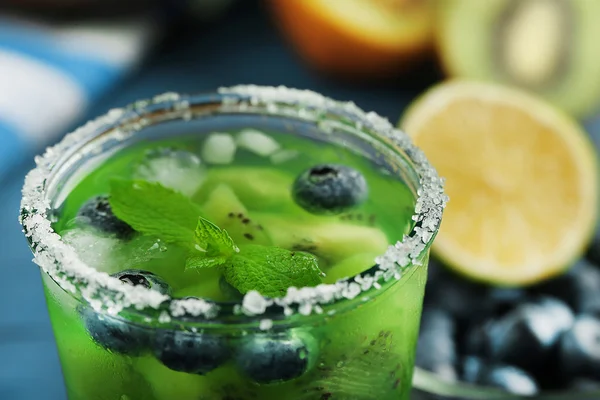 Kiwi and Blueberry cocktail on wooden background — Stock Photo, Image