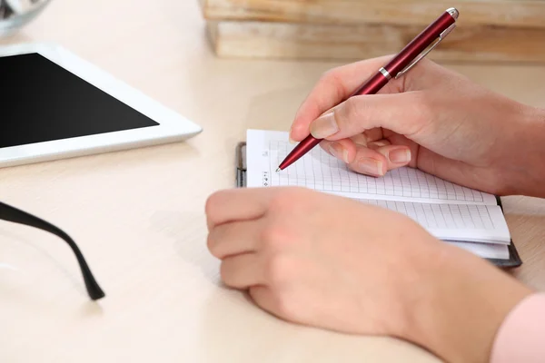 Woman write on notebook — Stok fotoğraf