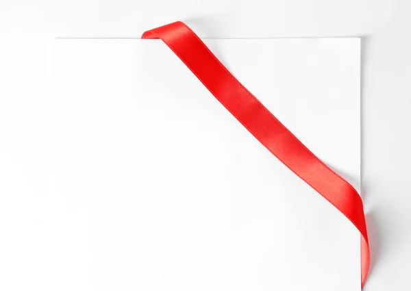 Shiny red ribbon with card — Stock Photo, Image