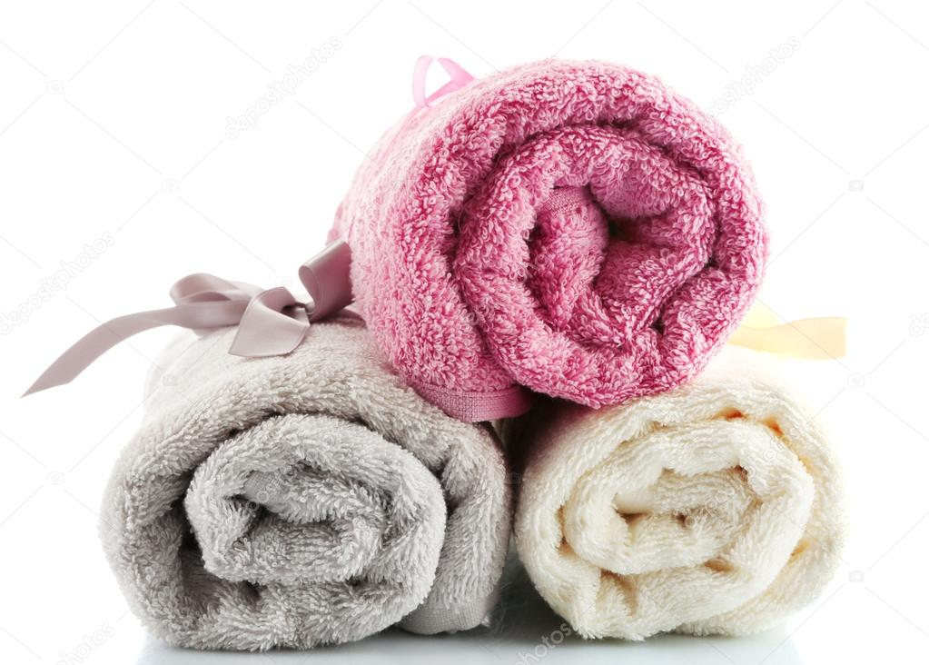 Rolled up colorful towels isolated on white
