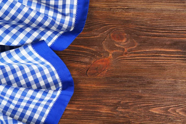 Napkin on wooden background — Stock Photo, Image