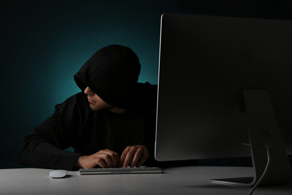 anonymous Hacker with computer 