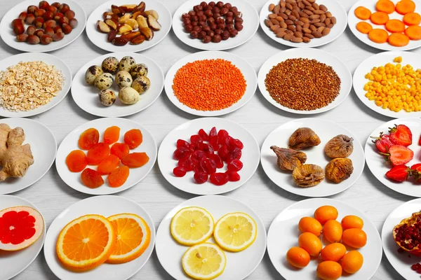 Set of orange products on wooden table, closeup — Stock Photo, Image