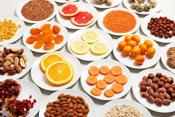 Set of orange products on wooden table, closeup — Stock Photo, Image