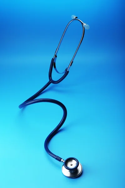 Stethoscope on blue background — Stock Photo, Image