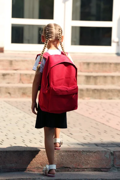Small girl near school — Stock Photo, Image