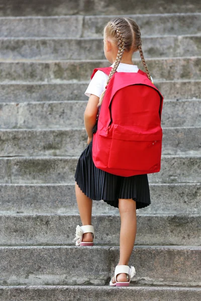 Small girl near school — Stock Photo, Image