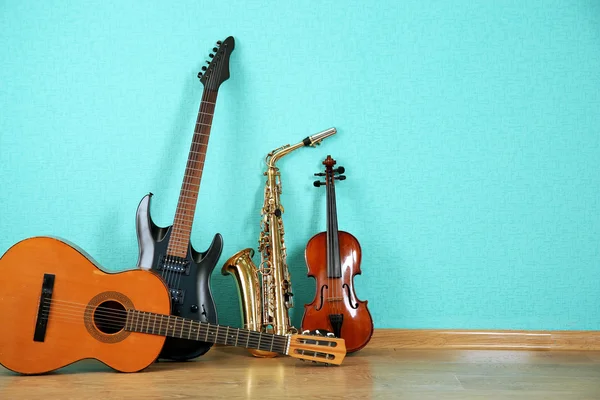 Musical instruments on turquoise — Stock Photo, Image