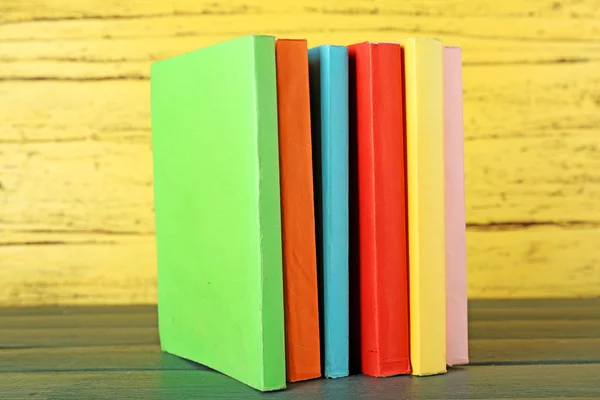 Stack of books on wooden table — Stock Photo, Image