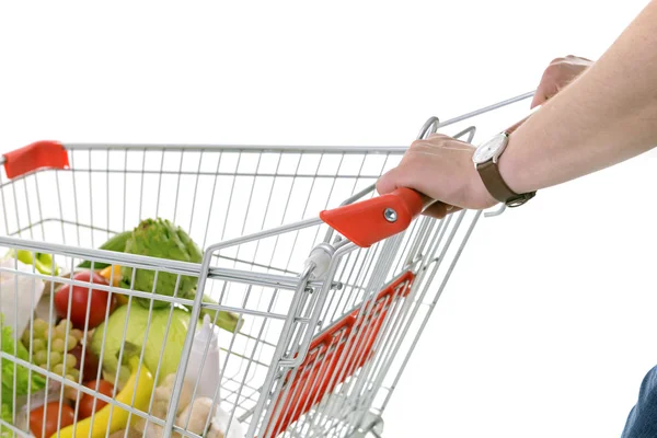 Jovem com carrinho de compras — Fotografia de Stock