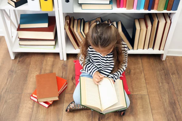 Beautiful little girl with books — Stock Photo, Image