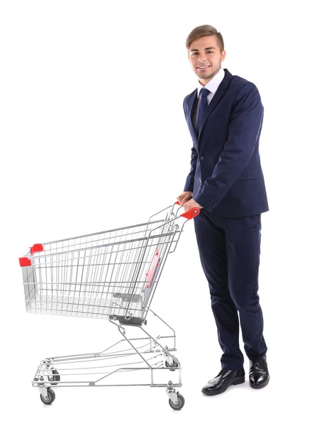 Young man with empty shopping cart — Stock Photo, Image