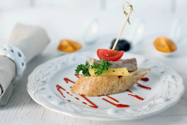 Tasty canape on wooden table, close up — Stock Photo, Image