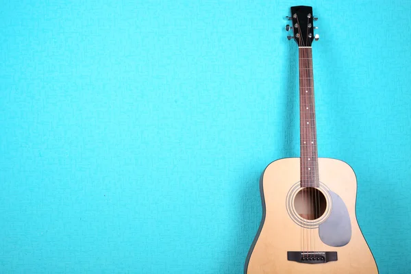 Classical guitar on blue wallpaper background — Stock Photo, Image
