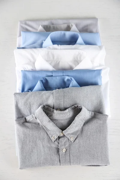 Business shirts on white table — Stock Photo, Image