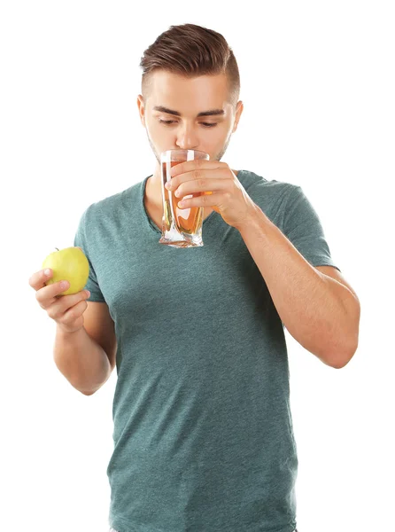 Young man drinking apple juice, isolated on white — Stock Photo, Image