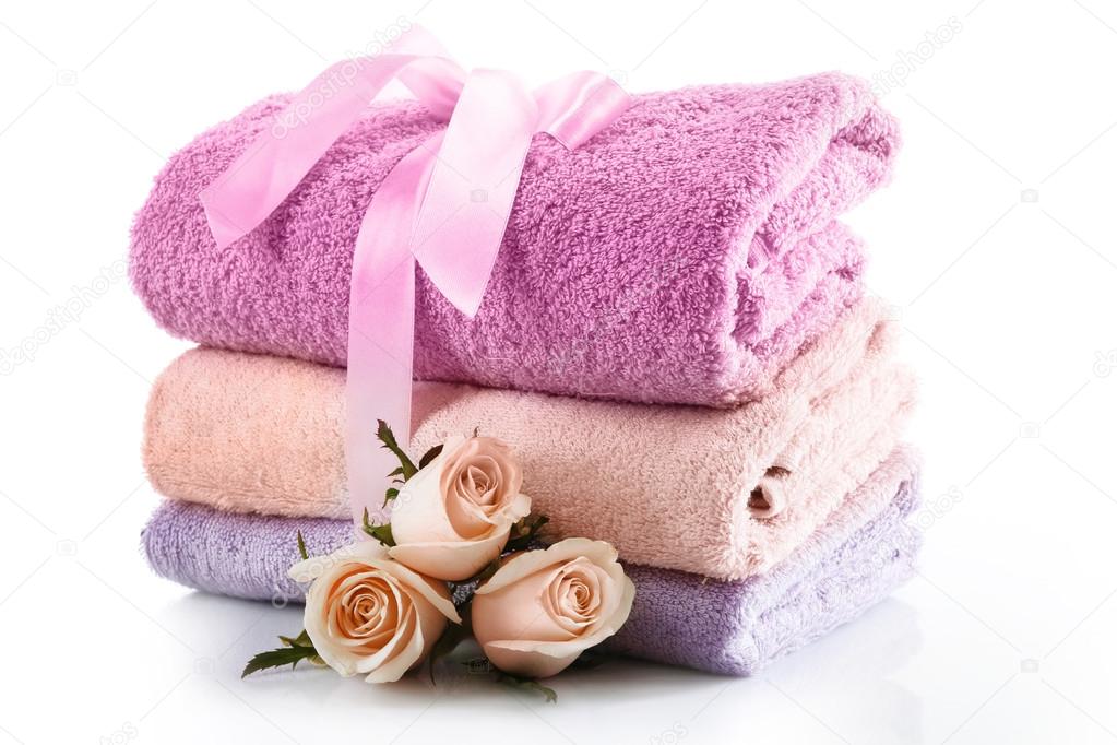Stack of colorful towels isolated on white