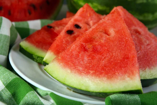 Slices of ripe watermelon on table close up — Stock Photo, Image