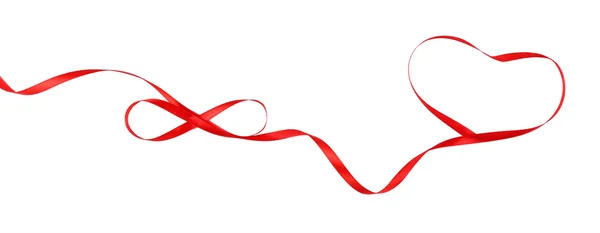 Red ribbon in shape of heart — Stock Photo, Image