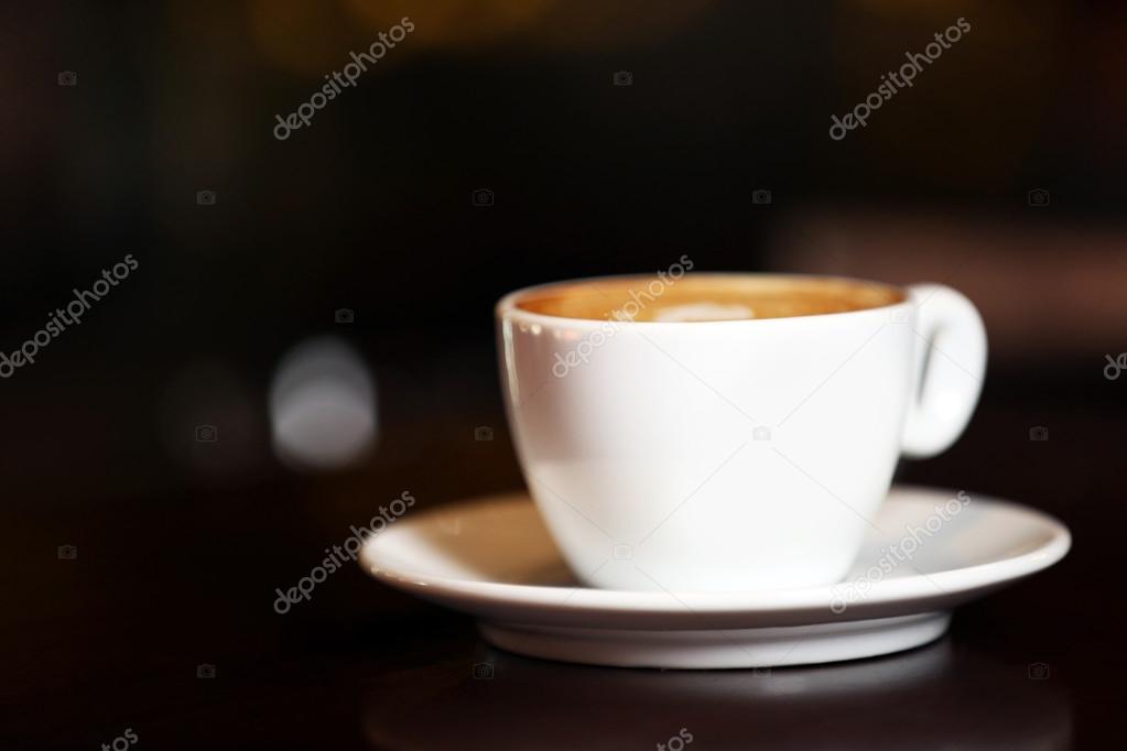 Cup of cappuccino on bar counter