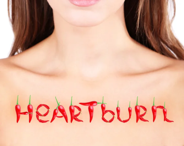 Word Heartburn on woman's body — Stock Photo, Image