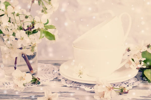 Tea cups and beautiful fruit blossom — Stock Photo, Image