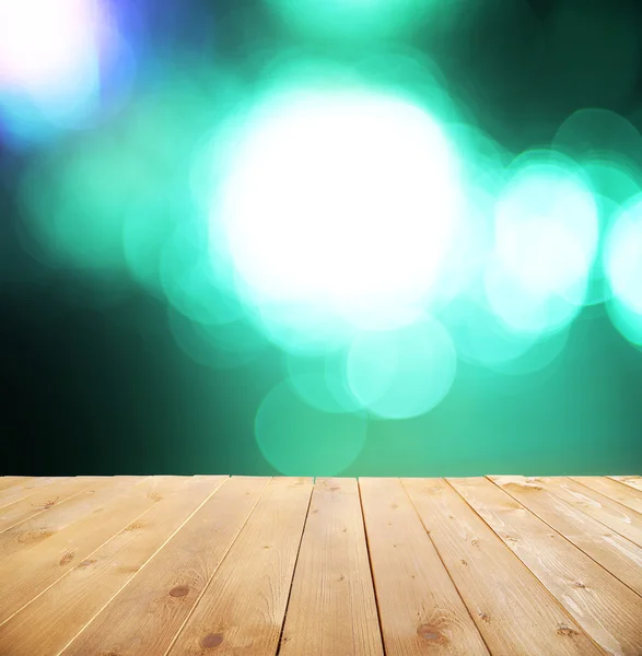 Wooden table with abstract blur — Stock Photo, Image