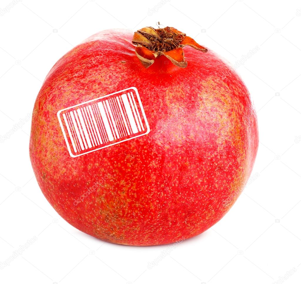 Juicy ripe pomegranate with barcode