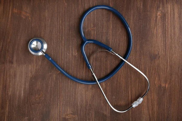 Stethoscope fából készült háttér — Stock Fotó