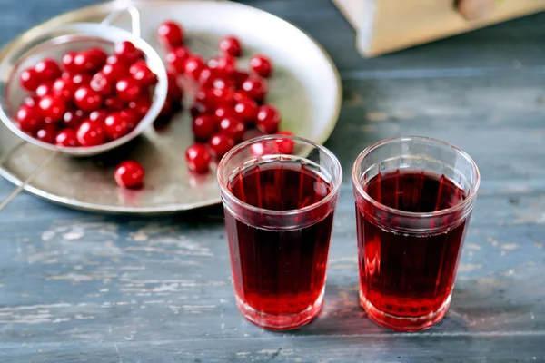 Sweet homemade cherry juice on table, on light background — Stock Photo, Image