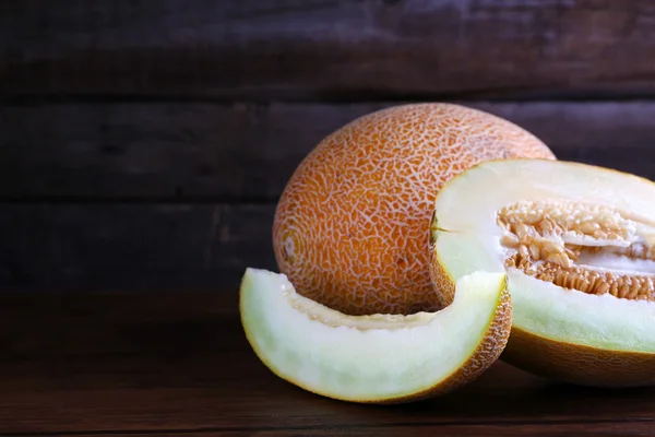 Ripe melon on wooden background — Stock Photo, Image