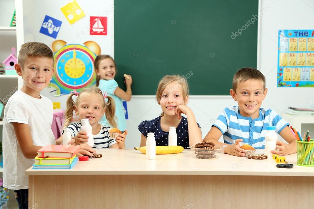 Cute children at lunch time