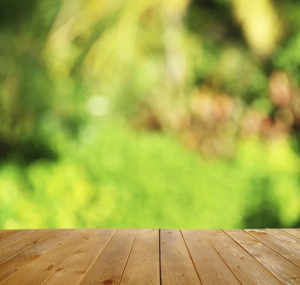 Wooden table  with abstract   background — Stock Photo, Image