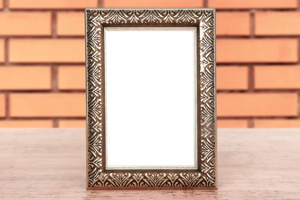 Old empty frame on table — Stock Photo, Image