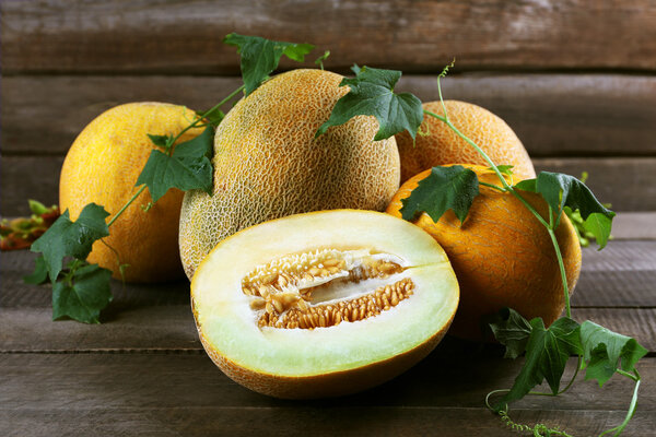 Ripe melons with green leaves