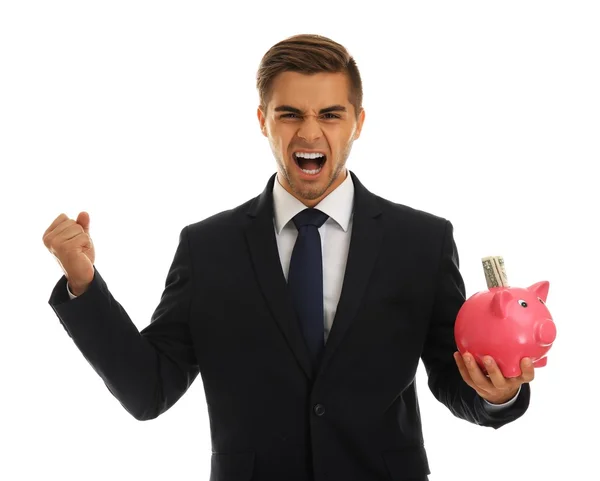 Elegante homem segurando porquinho banco com dinheiro isolado em branco — Fotografia de Stock