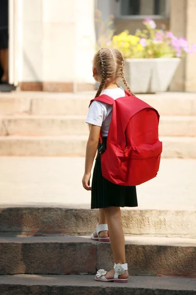 Small girl near school — Stock Photo, Image