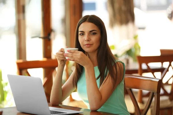 Beautiful young woman with laptop — Stock Photo, Image