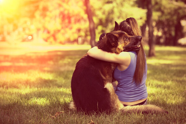 Young girl with dog in park
