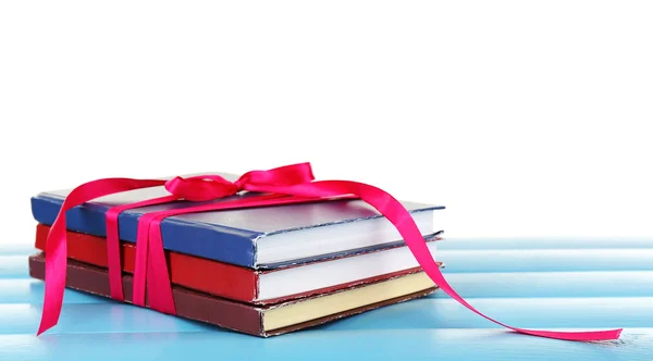 Stack of books with ribbon — Stock Photo, Image