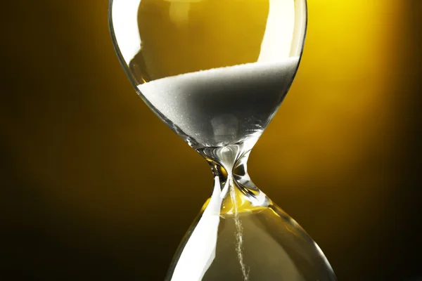 Hourglass on dark background — Stock Photo, Image