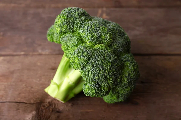 Fresh broccoli on wooden background — Stock Photo, Image