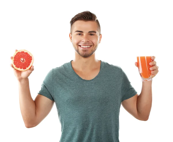 A fiatalember mutatja a grapefruit-lé, elszigetelt fehér üveg — Stock Fotó