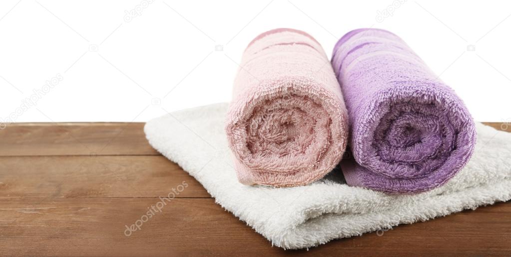 Rolled bath towels Stock Photo by ©belchonock 82963360