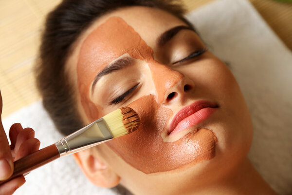 woman while facial cosmetic procedure