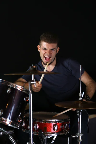 Drummer on dark background — Stock Photo, Image